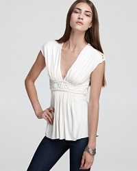Grecian goddess inspired, this striking Sky top boasts an ornately woven waist with a dramatic deep V neckline for the glamour you crave. Grecian goddess inspired, this striking Sky top boasts an ornately woven waist with a dramatic deep V neckline for the glamour you crave.