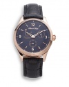 THE LOOKRound rose goldtone stainless steel case, 38mm (1.5)Smooth bezelBlack multi-function dialNumeral and bar hour markersTransparent case backBlack croc-print leather strapWater resistant to 3 ATMTHE MATERIALRose goldtone stainless steelCroc-print leatherORIGINImported