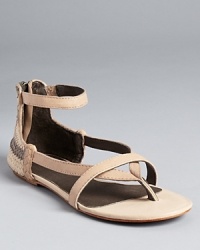 A woven, striped pattern at the heel takes these Joie sandals from essential basic to must-have chic. A woven, striped pattern at the heel takes these Joie sandals from essential basic to must-have chic.