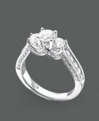 A three-stone ring with vintage appeal featuring round-cut diamonds (1-1/2 ct. t.w.) set in 14k white gold. A three-stone ring with vintage appeal featuring round-cut diamonds (1-1/2 ct. t.w.) set in 14k white gold.