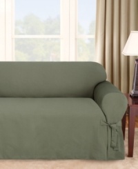 Featuring a narrow pinstripe weave in solid hues, Sure Fit's Logan sofa slipcover gives your furniture a bold new look. Subtle textured detail and decorative ties add to this slipcover's classic appeal. One piece. Featuring a narrow pinstripe weave in solid hues, Sure Fit's Logan sofa slipcover gives your furniture a bold new look. Subtle textured detail and decorative ties add to this slipcover's classic appeal. One piece.