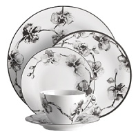 A captivating motif of lifelike orchids stands out in dramatic relief against a backdrop of vibrant white porcelain, giving this dinnerware from Michael Aram bold, artful presence. A captivating motif of lifelike orchids stands out in dramatic relief against a backdrop of vibrant white porcelain, giving this dinnerware from Michael Aram bold, artful presence.