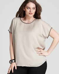 Intricate beading and sheer styling lend a delicate finish to a nude DKNYC Plus top. Team with sleek denim and metallic accents for effortless elegance. Intricate beading and sheer styling lend a delicate finish to a nude DKNYC Plus top. Team with sleek denim and metallic accents for effortless elegance.
