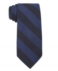 Bold bar stripes make a solitary statement on this skinny tie from Tommy Hilfiger. Bold bar stripes make a solitary statement on this skinny tie from Tommy Hilfiger.