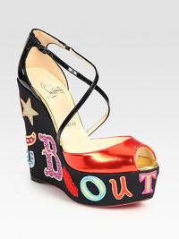 Adjustable patent leather criss-cross straps and a metallic leather upper rest upon a rhinestone-adorned fabric wedge that reads, Louboutin. Rhinestone-coated nylon wedge, 5 (125mm)Rhinestone-coated nylon platform, 1½ (40mm)Compares to a 3½ heel (90mm)Patent leather and metallic leather upperLeather liningSignature red leather solePadded insoleMade in ItalyOUR FIT MODEL RECOMMENDS ordering one half size up as this style runs small. Adjustable patent leather criss-cross straps and a metallic leather upper rest upon a rhinestone-adorned fabric wedge that reads, Louboutin. Rhinestone-coated nylon wedge, 5 (125mm)Rhinestone-coated nylon platform, 1½ (40mm)Compares to a 3½ heel (90mm)Patent leather and metallic leather upperLeather liningSignature red leather solePadded insoleMade in ItalyOUR FIT MODEL RECOMMENDS ordering one half size up as this style runs small.