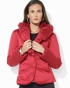 A lustrous quilted satin coat is finished with a dramatic shawl collar for added glamour.