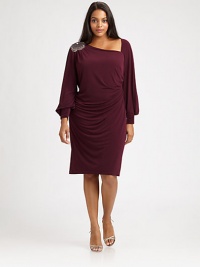 This sleek and sultry dress with a hint of stretch was made for your curves. Its alluring asymmetrical neckline is flawlessly complemented by a sparkling shoulder embellishment.Asymmetrical necklineBlouson sleevesBanded cuffsShoulder embellishmentConcealed back zipperFully linedAbout 25 from natural waist95% polyester/5% spandexDry cleanMade in USA of imported fabric This sleek and sultry dress with a hint of stretch was made for your curves. Its alluring asymmetrical neckline is flawlessly complemented by a sparkling shoulder embellishment.Asymmetrical necklineBlouson sleevesBanded cuffsShoulder embellishmentConcealed back zipperFully linedAbout 25 from natural waist95% polyester/5% spandexDry cleanMade in USA of imported fabric