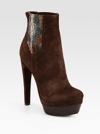Wildly chic suede ankle boot has elastic side gores, genuine snakeskin print trim and a stacked platform. Self-covered heel, 5½ (140mm)Stacked platform, 1½ (40mm)Compares to a 4 heel (100mm)Suede, snakeskin print and elastic upperPull-on styleLeather lining and solePadded insoleImported Wildly chic suede ankle boot has elastic side gores, genuine snakeskin print trim and a stacked platform. Self-covered heel, 5½ (140mm)Stacked platform, 1½ (40mm)Compares to a 4 heel (100mm)Suede, snakeskin print and elastic upperPull-on styleLeather lining and solePadded insoleImported