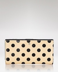 Upgrade your everyday wallet to this kate spade new york design. A shining on-duty choice crafted of patent leather, its snap closure opens to an interior that will keep you organized in style. Upgrade your everyday wallet to this kate spade new york design. A shining on-duty choice crafted of patent leather, its snap closure opens to an interior that will keep you organized in style.