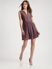 EXCLUSIVELY AT SAKS. EXCLUSIVELY AT SAKS.