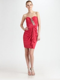Equal parts sexy and sweet, this colorful style is tailored with allover ruching and accented with a beaded detail.Strapless sweetheart necklineBeaded front detailAllover ruchingFront drapeConcealed back zipFully linedAbout 23 from natural waistRayonSpot cleanMade in USA of imported fabricModel shown is 5'10½ (179cm) wearing US size 4.OUR FIT MODEL RECOMMENDS ordering true size. Equal parts sexy and sweet, this colorful style is tailored with allover ruching and accented with a beaded detail.Strapless sweetheart necklineBeaded front detailAllover ruchingFront drapeConcealed back zipFully linedAbout 23 from natural waistRayonSpot cleanMade in USA of imported fabricModel shown is 5'10½ (179cm) wearing US size 4.OUR FIT MODEL RECOMMENDS ordering true size.
