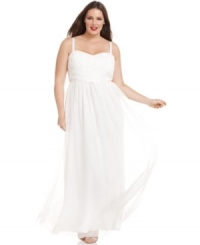 This elegant plus size evening gown by Adrianna Papell features a beautiful sweetheart neckline and a rosette applique at the bust. The ribbon tie at the waist and flowing chiffon skirt are sweet touches. This elegant plus size evening gown by Adrianna Papell features a beautiful sweetheart neckline and a rosette applique at the bust. The ribbon tie at the waist and flowing chiffon skirt are sweet touches.