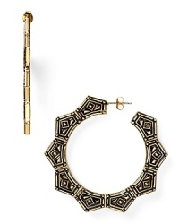 Belle Noel channels gypsy glamor with this pair of plated hoop earrings, cast in yellow gold with ornate engravings. It's a statement style for the Boho trope. Belle Noel channels gypsy glamor with this pair of plated hoop earrings, cast in yellow gold with ornate engravings. It's a statement style for the Boho trope.