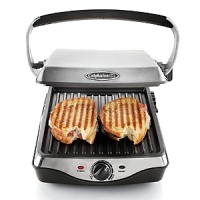 The Calphalon Panini Grill allows you to enjoy delicious, authentic tasting panini sandwiches without sacrificing counter space. The high performance bronze nonstick means its perfect for low-fat cooking, and Calphalon's exclusive internal Opti-Heat system ensures even heat delivery. The adjustable top grill plate accomodates thick sandwiches, burgers or delicate fish filets. The Calphalon Panini Grill allows you to enjoy delicious, authentic tasting panini sandwiches without sacrificing counter space. The high performance bronze nonstick means its perfect for low-fat cooking, and Calphalon's exclusive internal Opti-Heat system ensures even heat delivery. The adjustable top grill plate accomodates thick sandwiches, burgers or delicate fish filets.