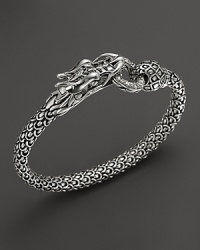 John Hardy's Naga bracelet lends fierce style with a dragon design crafted in sterling silver, accented with diamonds. John Hardy's Naga bracelet lends fierce style with a dragon design crafted in sterling silver, accented with diamonds.