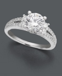 A traditional engagement ring with a special spin. A beautiful round-cut solitaire diamond (1-1/4 ct. t.w.) features two bordering rows of round-cut diamond (1/2 ct. t.w.) and an intricate side design with complementing diamond accents. Ring crafted in enduring 18k white gold. IGI Certified diamonds. A traditional engagement ring with a special spin. A beautiful round-cut solitaire diamond (1-1/4 ct. t.w.) features two bordering rows of round-cut diamond (1/2 ct. t.w.) and an intricate side design with complementing diamond accents. Ring crafted in enduring 18k white gold. IGI Certified diamonds.