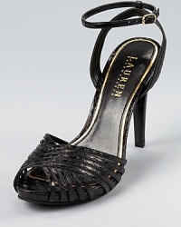 A strappy, snakeskin embossed silhouette from Lauren Ralph Lauren lends itself to daytime and after-hours alike. A strappy, snakeskin embossed silhouette from Lauren Ralph Lauren lends itself to daytime and after-hours alike.