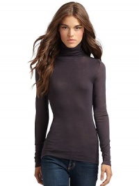 THE LOOKTurtleneck Long semi-sheer sleeves Exposed seam details THE FITAbout 25 from shoulder to hemTHE MATERIALCottonCARE & ORIGINDry cleanImportedModel shown is 5'11 (180cm) wearing US size Small. THE LOOKTurtleneck Long semi-sheer sleeves Exposed seam details THE FITAbout 25 from shoulder to hemTHE MATERIALCottonCARE & ORIGINDry cleanImportedModel shown is 5'11 (180cm) wearing US size Small.