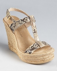 Snakeskin printed leather mingles with braided jute on these Delman espadrilles, a stunning standout for day or for night. Snakeskin printed leather mingles with braided jute on these Delman espadrilles, a stunning standout for day or for night.
