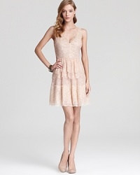 With delicate tiered lace, BCBGMAXAZRIA's neutral-hued dress lends a soft, vintage-inspired look. With delicate tiered lace, BCBGMAXAZRIA's neutral-hued dress lends a soft, vintage-inspired look.