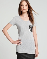 This Burberry Brit tee brings on the bling with a statement studded pocket. Let the style shine against dark denim for a luxe take on your classic jeans and tee. This Burberry Brit tee brings on the bling with a statement studded pocket. Let the style shine against dark denim for a luxe take on your classic jeans and tee.