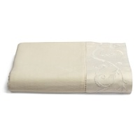 This luxurious all-white bedding ensemble incorporates couture-inspired details - from intricate floral embroidery to elegant silk matelasse - for a feminine vision of modern romance. This luxurious all-white bedding ensemble incorporates couture-inspired details - from intricate floral embroidery to elegant silk matelasse - for a feminine vision of modern romance.