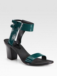 A sculpted heel lifts this minimalist design of fine-grain patent leather with adjustable ankle straps. Stacked heel, 3¼ (80mm)Snakeskin and suede upperPatent leather lining and solePadded insoleImported A sculpted heel lifts this minimalist design of fine-grain patent leather with adjustable ankle straps. Stacked heel, 3¼ (80mm)Snakeskin and suede upperPatent leather lining and solePadded insoleImported