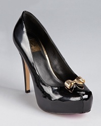 In polished patent, these ultra feminine DV Dolce Vita pumps take a seductive stance on the platform. In polished patent, these ultra feminine DV Dolce Vita pumps take a seductive stance on the platform.