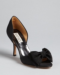 Bow, peep: these Badgley Mischka evening pumps feature elegant double bow details at each toe. Bow, peep: these Badgley Mischka evening pumps feature elegant double bow details at each toe.