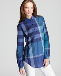 The iconic check print makes a bold impression on the classic Burberry Brit tunic for sophisticated edge. The iconic check print makes a bold impression on the classic Burberry Brit tunic for sophisticated edge.