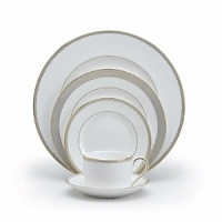 Rings of gold adorn fine white bone china with the lustrous shine of a wedding band. White bone china features two different border trims of gold, a wide corded border of textured grosgrain ribbon on some pieces, a narrow edge on others. Rings of gold adorn fine white bone china with the lustrous shine of a wedding band. White bone china features two different border trims of gold, a wide corded border of textured grosgrain ribbon on some pieces, a narrow edge on others.