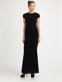 A shimmering, floor-length silhouette shaped with an elegant high neckline and bold back cutout.RoundneckShort sleevesBack cutout with button closureExposed back zipSlightly flared hemAbout 43 from natural waist76% nylon/19% metallic/5% spandexDry cleanImportedModel shown is 5'9½ (176cm) wearing US size 4. A shimmering, floor-length silhouette shaped with an elegant high neckline and bold back cutout.RoundneckShort sleevesBack cutout with button closureExposed back zipSlightly flared hemAbout 43 from natural waist76% nylon/19% metallic/5% spandexDry cleanImportedModel shown is 5'9½ (176cm) wearing US size 4.