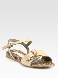 Faux patent leather sandal with a leopard-print footbed for subtle styling. Faux patent leather upperAdjustable ankle strapFaux leather liningRubber solePadded insoleImported Faux patent leather sandal with a leopard-print footbed for subtle styling. Faux patent leather upperAdjustable ankle strapFaux leather liningRubber solePadded insoleImported