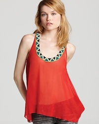A tribal-inspired beaded pattern lends editorial edge to this sheer Aqua tank for statement status from dusk till dawn. Pair the fiery look with spray-on denim for style with a downtown directive. A tribal-inspired beaded pattern lends editorial edge to this sheer Aqua tank for statement status from dusk till dawn. Pair the fiery look with spray-on denim for style with a downtown directive.