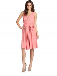 THE LOOKSurplice v-neckAllover ruchingTies at waist wrap-around bodiceSide zip with hook-and-eye closureTHE FITAbout 41 from shoulder to hemTHE MATERIAL69% acetate/23% nylon/8% elastaneFully linedCARE & ORIGINDry cleanImportedModel shown is 5'10½ (179cm) wearing US size 4. THE LOOKSurplice v-neckAllover ruchingTies at waist wrap-around bodiceSide zip with hook-and-eye closureTHE FITAbout 41 from shoulder to hemTHE MATERIAL69% acetate/23% nylon/8% elastaneFully linedCARE & ORIGINDry cleanImportedModel shown is 5'10½ (179cm) wearing US size 4.