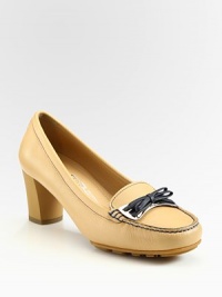Leather moccasin-inspired style with a chunky heel and bow adornment. Self-covered heel, 2½ (65mm)Leather upperLeather lining and solePadded insoleMade in Italy Leather moccasin-inspired style with a chunky heel and bow adornment. Self-covered heel, 2½ (65mm)Leather upperLeather lining and solePadded insoleMade in Italy