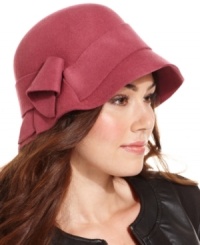 Dressed up with a mod bow accent, this classic wool cloche made from Nine West is the perfect piece for  chilly weather.