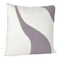 A soft wave of shiny beads against a neutral background adorn this decorative pillow from DIANE von FURSTENBERG.