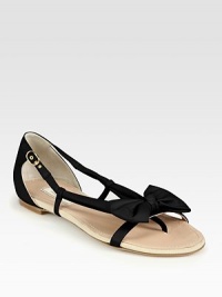 Soft leather flat has a thong front, fabulously feminine bow and an adjustable ankle strap. Leather upperLeather lining and solePadded insoleMade in ItalyOUR FIT MODEL RECOMMENDS ordering true size. 