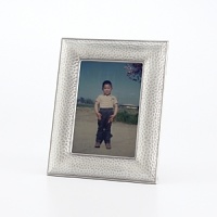 Elegantly display your favorite photos with this pebble-embossed Prinz metal frame in a radiant silver-tone hue. Elegantly display your favorite photos with this pebble-embossed Prinz metal frame in a radiant silver-tone hue.