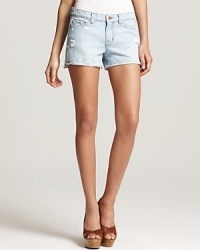 With a frayed, unfinished hem and ultra-light wash, these J Brand denim shorts are packed with vintage flair. With a frayed, unfinished hem and ultra-light wash, these J Brand denim shorts are packed with vintage flair.
