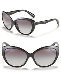 Prada's cat eye sunglasses with thick frames and metal triangle stud accents, the must-have accessory of the season. Prada's cat eye sunglasses with thick frames and metal triangle stud accents, the must-have accessory of the season.