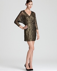 Dolman sleeves lend a laid-back look to a shimmering lace Trina Turk dress. Dolman sleeves lend a laid-back look to a shimmering lace Trina Turk dress.