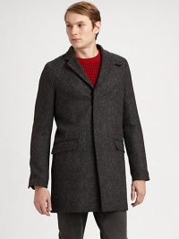 A Japanese wool coat with an elongated silhouette and concealed button closure. Notched collarConcealed button closureFlap pocketsAbout 35 from shoulder to hemWoolDry cleanImported A Japanese wool coat with an elongated silhouette and concealed button closure. Notched collarConcealed button closureFlap pocketsAbout 35 from shoulder to hemWoolDry cleanImported