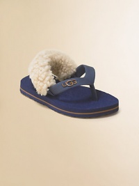 A cozy twist on the favorite flip flop, with a back strap lined in fluffy sheepskin to keep them on tiny feet.Rubber thong upperSheepskin-lined back strap with elastic tabsRubber soleRaised logo on thongImported A cozy twist on the favorite flip flop, with a back strap lined in fluffy sheepskin to keep them on tiny feet.Rubber thong upperSheepskin-lined back strap with elastic tabsRubber soleRaised logo on thongImported