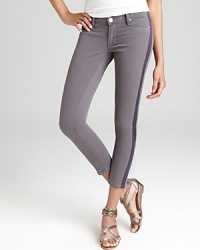 Contrast stripes down the legs add a pop of color to these Hudson skinny jeans. Contrast stripes down the legs add a pop of color to these Hudson skinny jeans.