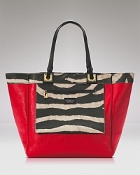 A functional, coolly reversible Furla tote in leather is a step beyond tried-and-true, with an exterior zip pocket which secures with a zip closure. A functional, coolly reversible Furla tote in leather is a step beyond tried-and-true, with an exterior zip pocket which secures with a zip closure.