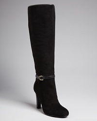 IVANKA TRUMP adds fine detail in the form of delicate buckled harness belts to stately suede tall boots. IVANKA TRUMP adds fine detail in the form of delicate buckled harness belts to stately suede tall boots.