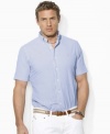 The embodiment of preppy heritage, a classic-fitting shirt is rendered in light-as-air seersucker cotton with sleek stripes for a casual warm-weather look.