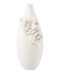Sculpted camellia blossoms pop with peachy accents against this glossy white Flora vase. A quiet beauty in graceful Lenox porcelain. Sculpted camellia blossoms pop with peachy accents against this glossy white Flora vase. A quiet beauty in graceful Lenox porcelain.